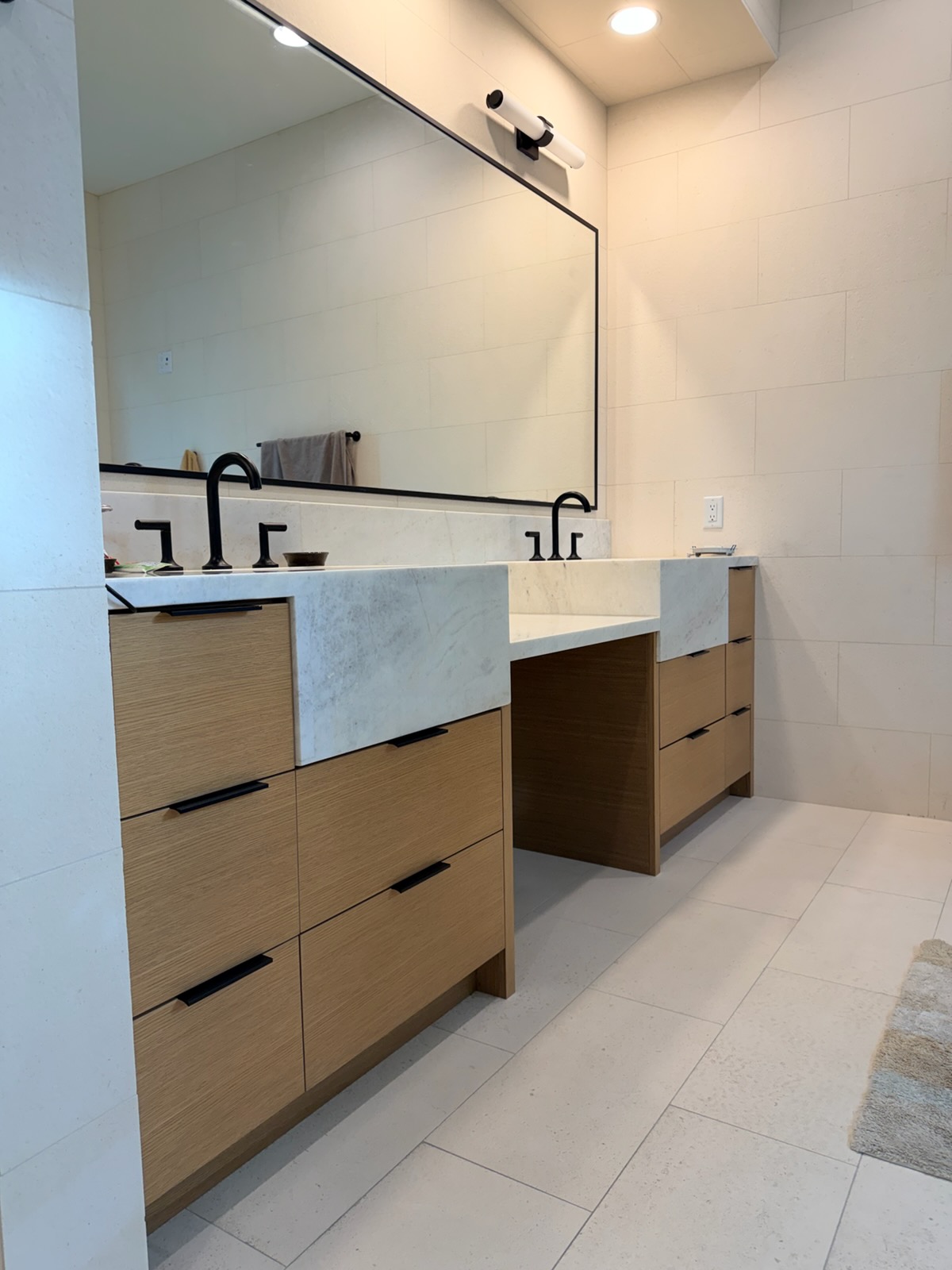 Custom oak bathroom vanity with stone counters